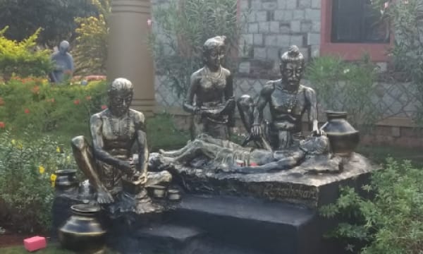 Bronze sculpture group depicting a traditional naturopathy therapy session