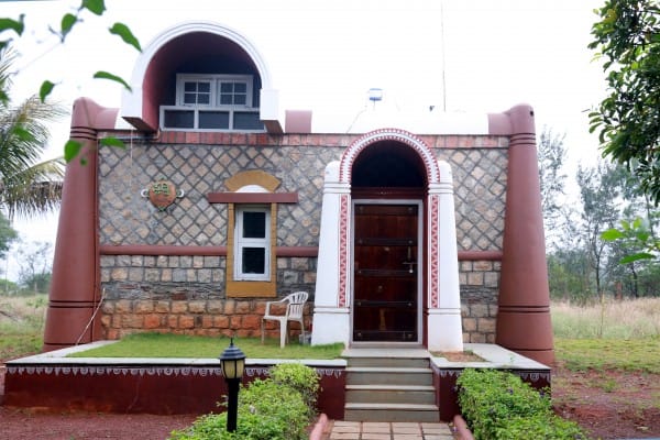 Exterior view of a beautifully constructed stone cottage